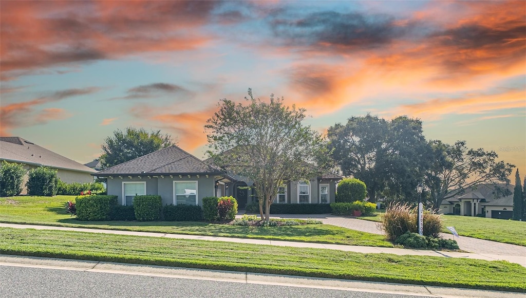 view of front of home with a lawn