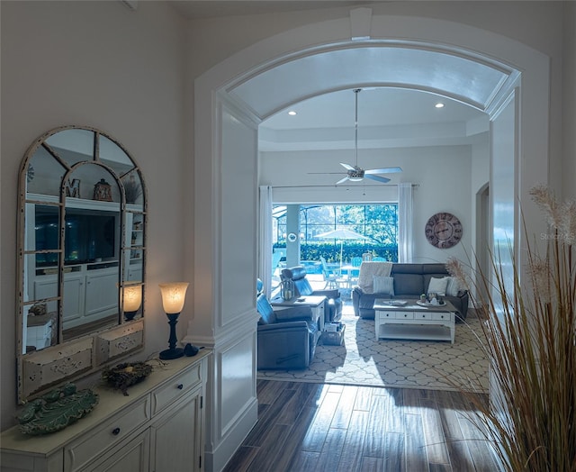 hallway with ornamental molding and hardwood / wood-style floors