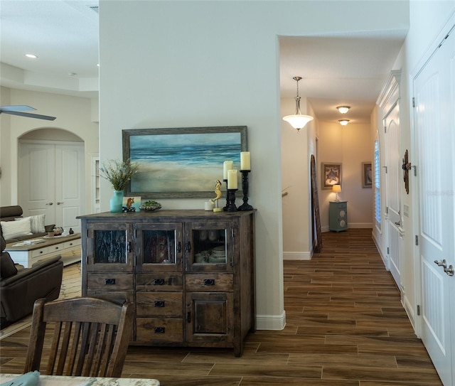 hallway featuring dark hardwood / wood-style flooring