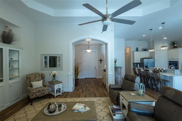 living room with hardwood / wood-style floors and ceiling fan