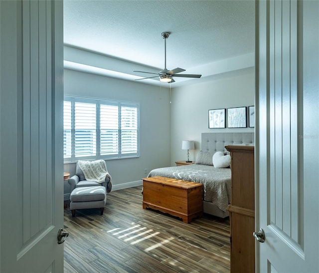 bedroom featuring hardwood / wood-style floors and ceiling fan