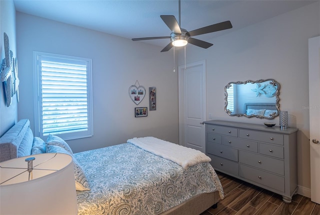 bedroom featuring dark wood-type flooring and ceiling fan