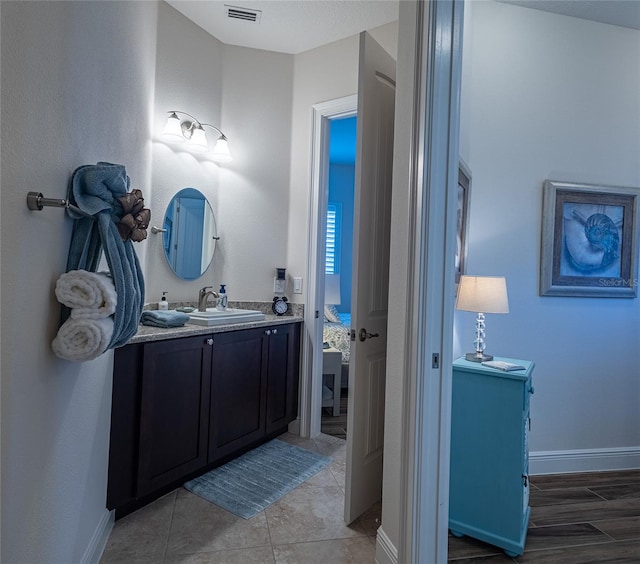 bathroom featuring vanity and tile patterned flooring