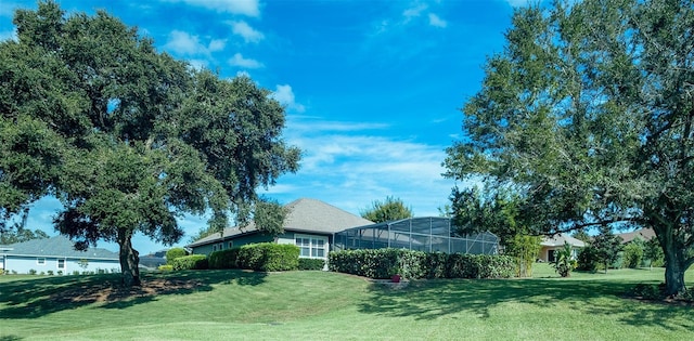 view of yard featuring a lanai