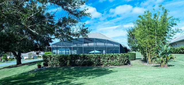 view of yard with a lanai