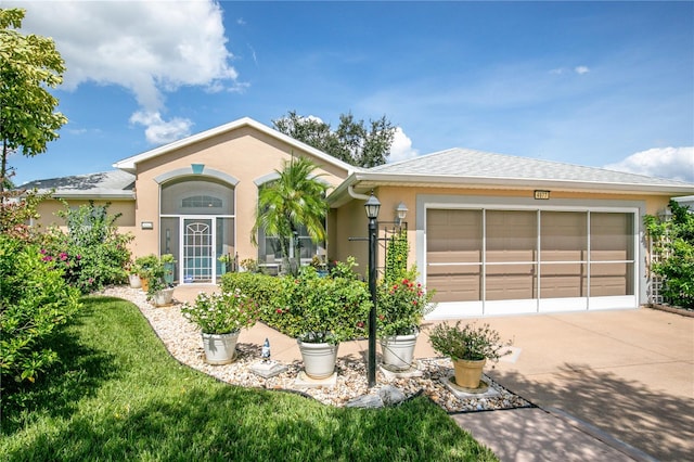 ranch-style house featuring a garage