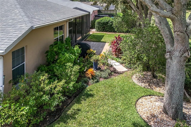 view of yard with a sunroom