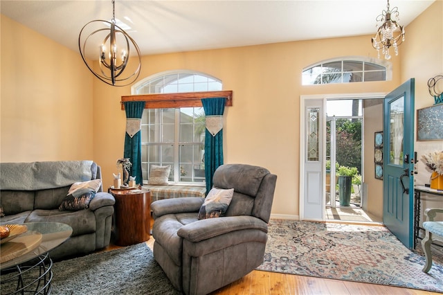 living room with hardwood / wood-style flooring and a chandelier