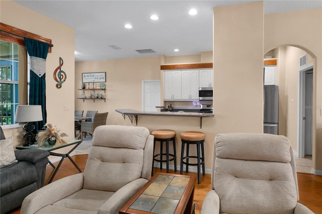 living room with light hardwood / wood-style floors