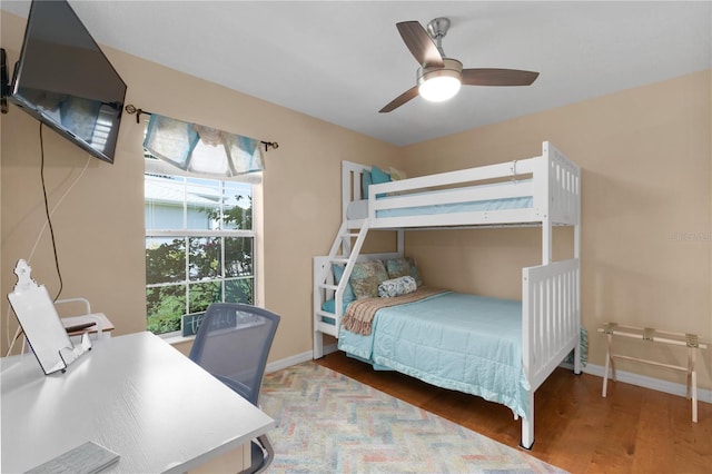 bedroom featuring hardwood / wood-style floors and ceiling fan