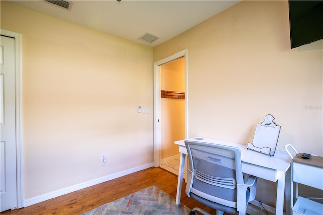 home office featuring hardwood / wood-style flooring