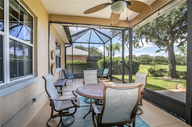 sunroom with ceiling fan and a healthy amount of sunlight