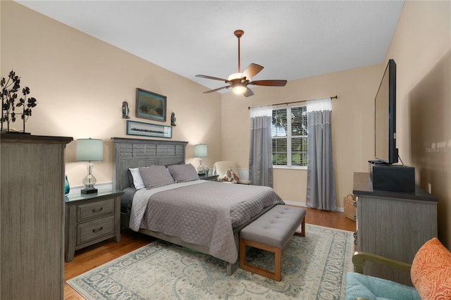 bedroom featuring ceiling fan and light hardwood / wood-style flooring