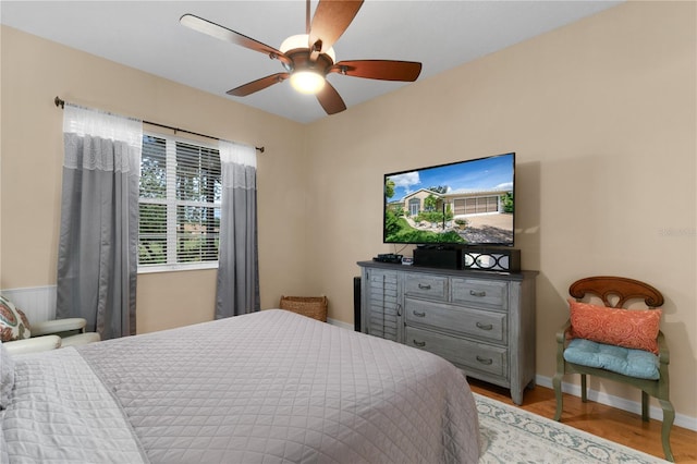 bedroom featuring ceiling fan and light hardwood / wood-style floors