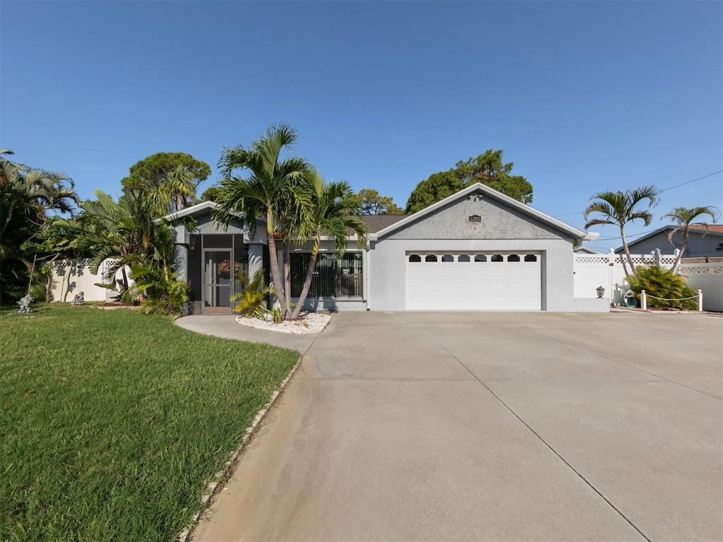 view of front facade with a front yard and a garage