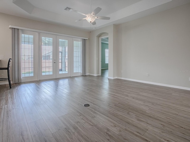 spare room with light hardwood / wood-style floors and ceiling fan