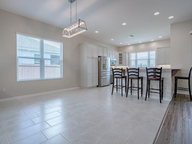 dining space with light wood-type flooring