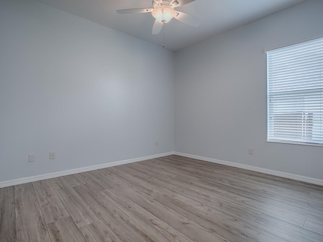 unfurnished room with ceiling fan and light wood-type flooring