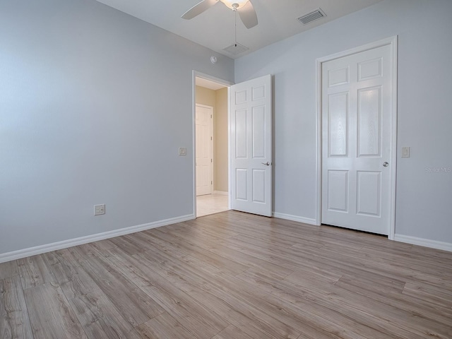 unfurnished bedroom featuring light hardwood / wood-style flooring and ceiling fan