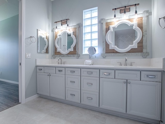 bathroom featuring tile patterned flooring and vanity