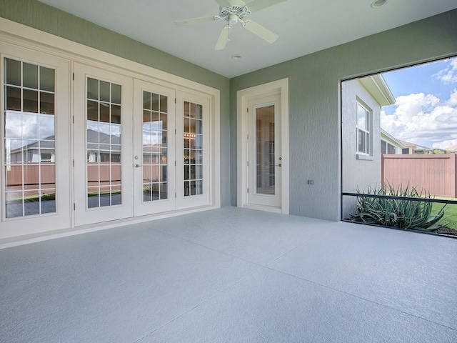 view of patio / terrace featuring ceiling fan and french doors