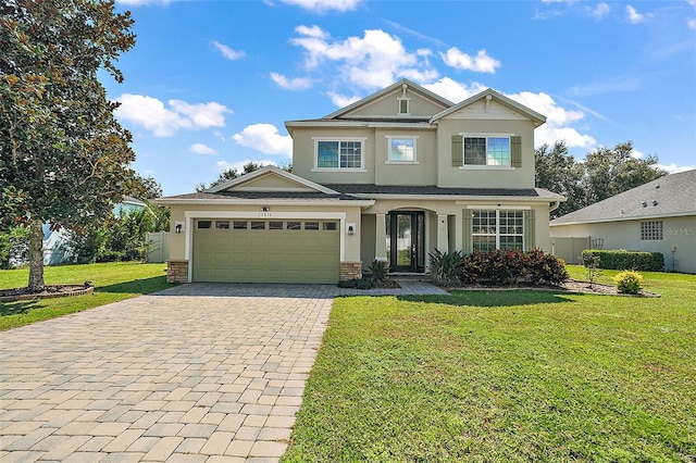 view of front facade featuring a front yard and a garage