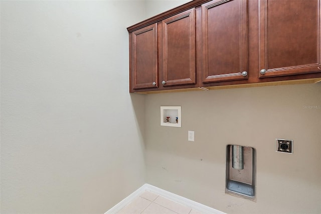 laundry area featuring hookup for a washing machine, light tile patterned floors, cabinets, and hookup for an electric dryer