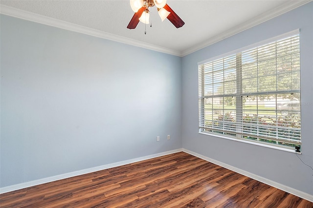 spare room with crown molding, ceiling fan, and wood-type flooring