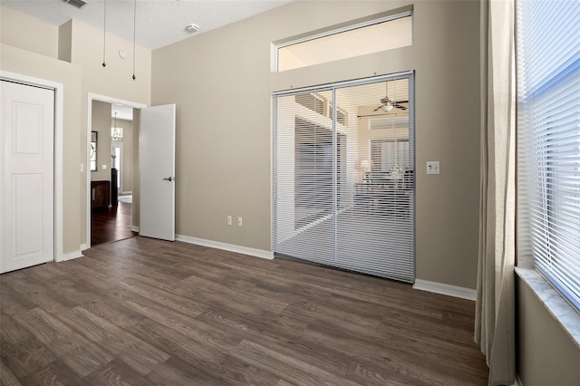 spare room featuring dark hardwood / wood-style floors and ceiling fan