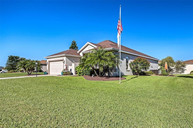 view of front of house with a garage and a front yard