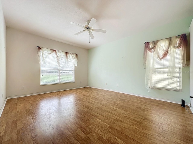 unfurnished room featuring ceiling fan and wood-type flooring