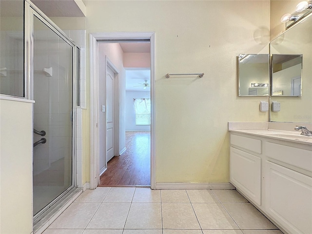 bathroom with vanity, ceiling fan, tile patterned floors, and an enclosed shower