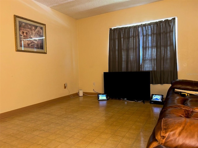 living room featuring a textured ceiling