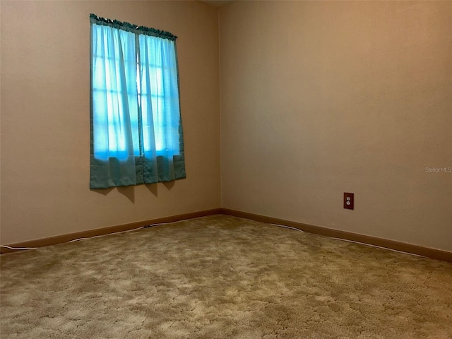 empty room with carpet flooring