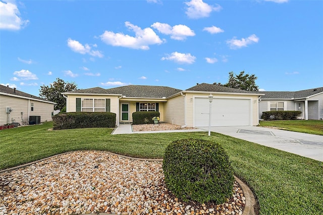 ranch-style house featuring a front yard and a garage