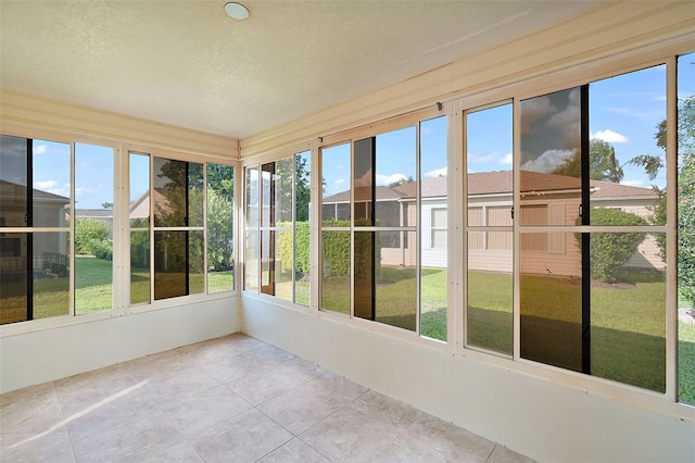 unfurnished sunroom with plenty of natural light