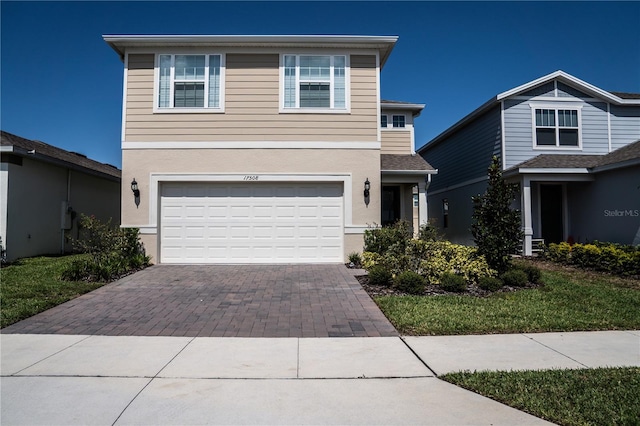 view of front of property with a garage