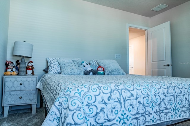 bedroom featuring dark colored carpet