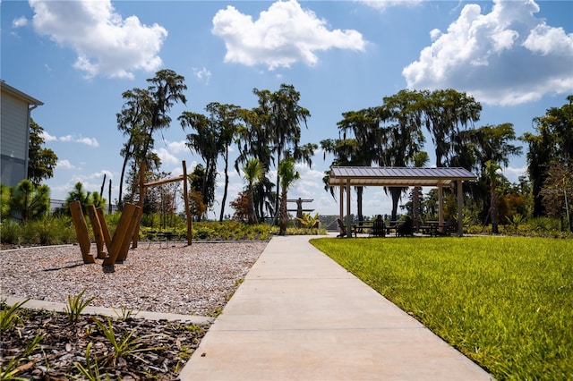 view of community with a lawn and a gazebo