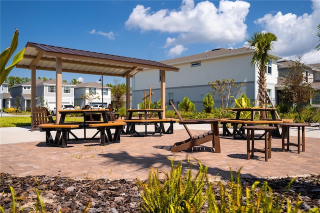 view of home's community with a patio area