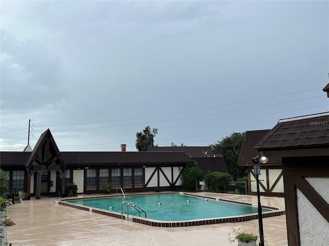 view of pool featuring a patio area