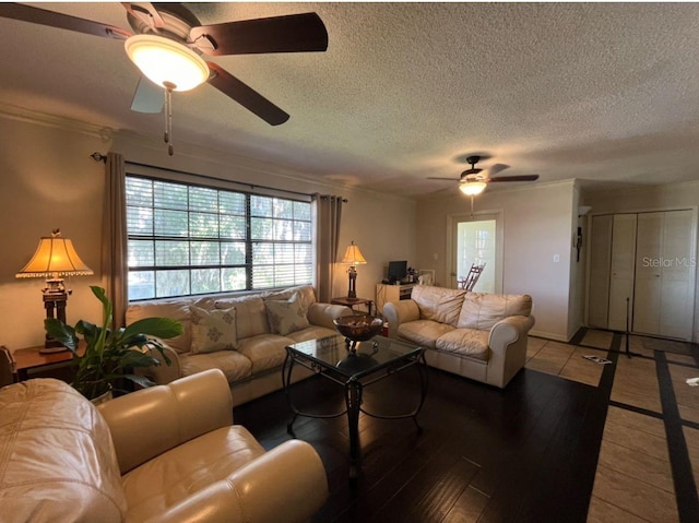 living room featuring a textured ceiling, light hardwood / wood-style floors, and ceiling fan