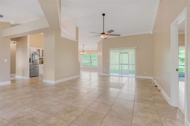 unfurnished room featuring light tile patterned floors, ceiling fan with notable chandelier, and crown molding