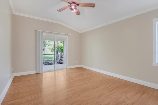 unfurnished room with crown molding, light hardwood / wood-style flooring, and vaulted ceiling