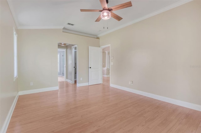 spare room featuring ceiling fan, light wood-type flooring, and ornamental molding