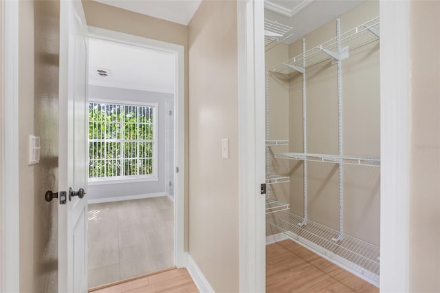 spacious closet featuring hardwood / wood-style flooring