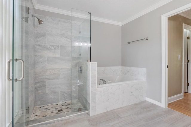 bathroom featuring crown molding and independent shower and bath