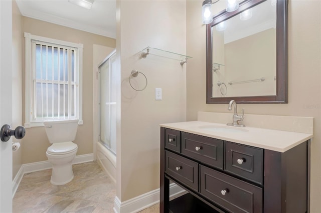 full bathroom with vanity, toilet, ornamental molding, and enclosed tub / shower combo