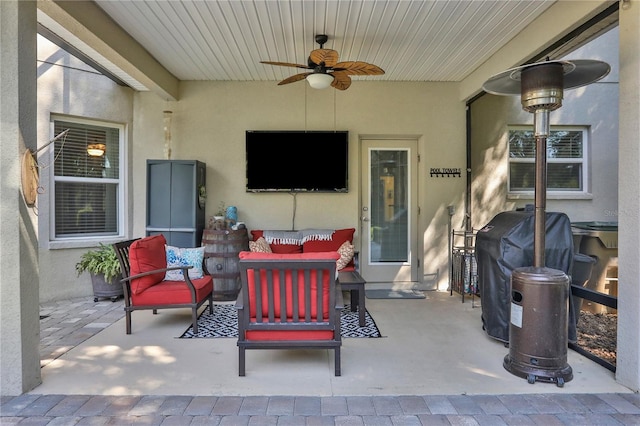 view of patio / terrace featuring area for grilling, ceiling fan, and outdoor lounge area