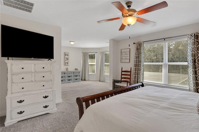 bedroom featuring light carpet and ceiling fan